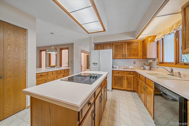31 Irene Ct, Broomfield, CO 80020 - kitchen with black appliances, a sink, brown cabinets, a center island, and light countertops