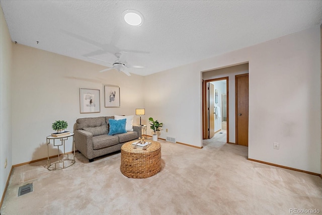 31 Irene Ct, Broomfield, CO 80020 - living room with ceiling fan, baseboards, carpet floors, and a textured ceiling