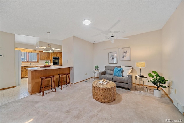 31 Irene Ct, Broomfield, CO 80020 - living room with baseboards, light carpet, and ceiling fan