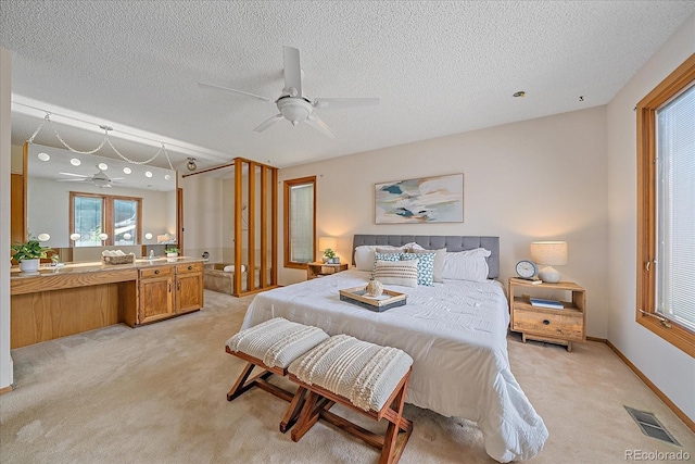 31 Irene Ct, Broomfield, CO 80020 - bedroom with light colored carpet, a textured ceiling, and a ceiling fan