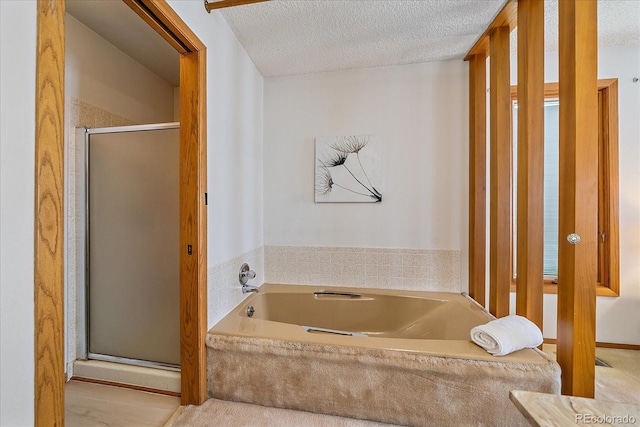 31 Irene Ct, Broomfield, CO 80020 - full bath with a stall shower, a bath, and a textured ceiling