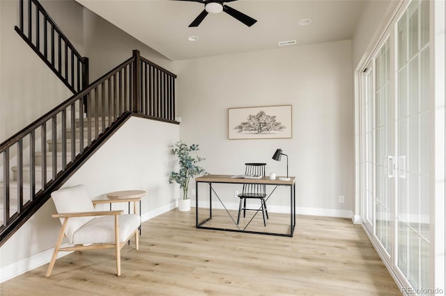 home office with wood finished floors, baseboards, and a ceiling fan