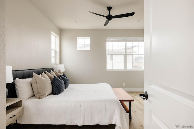 bedroom featuring light wood finished floors, baseboards, a ceiling fan, and recessed lighting