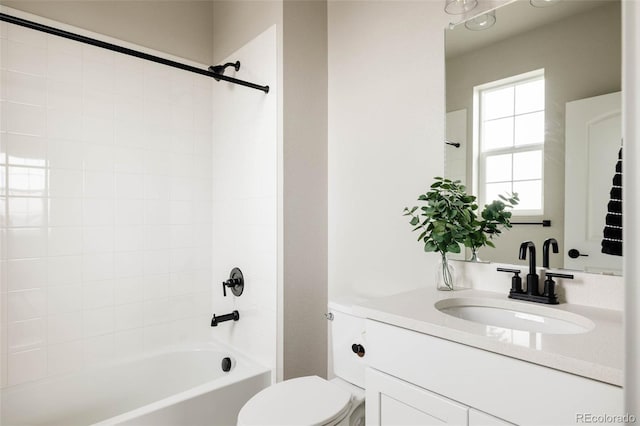 bathroom with toilet, washtub / shower combination, and vanity