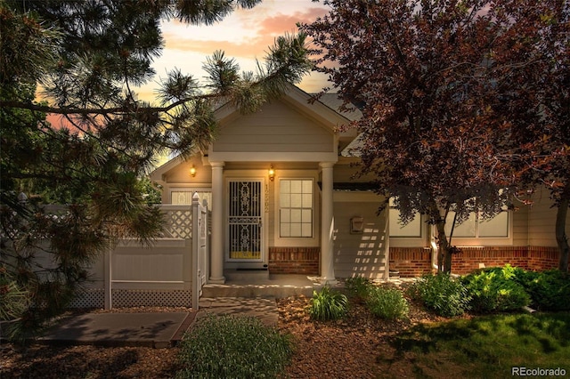 12502 E Harvard Cir, Aurora, CO 80014 - outdoor structure at dusk featuring a porch