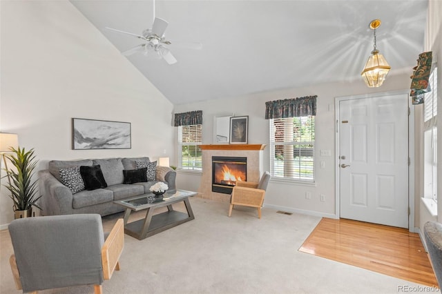 12502 E Harvard Cir, Aurora, CO 80014 - living room featuring high vaulted ceiling, a tiled fireplace, carpet, and ceiling fan