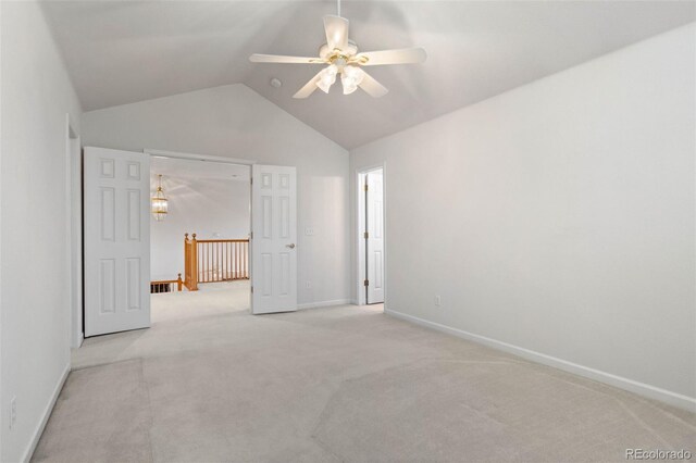 12502 E Harvard Cir, Aurora, CO 80014 - empty room featuring lofted ceiling, a ceiling fan, and carpet flooring