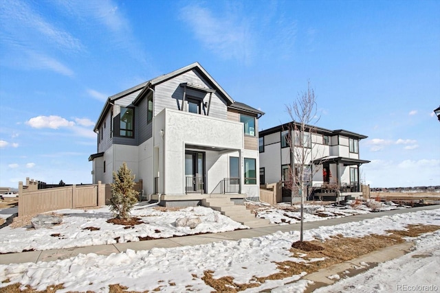 view of front of property featuring a balcony