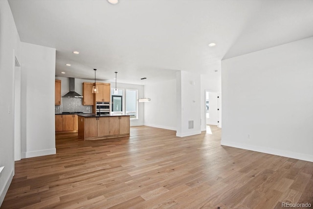 unfurnished living room featuring light wood-type flooring