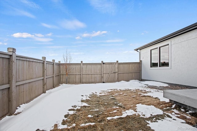 view of yard covered in snow