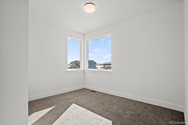 unfurnished room featuring carpet flooring