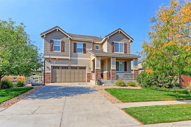 craftsman inspired home featuring a front lawn, covered porch, and a garage