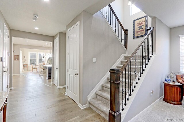 stairway featuring wood-type flooring