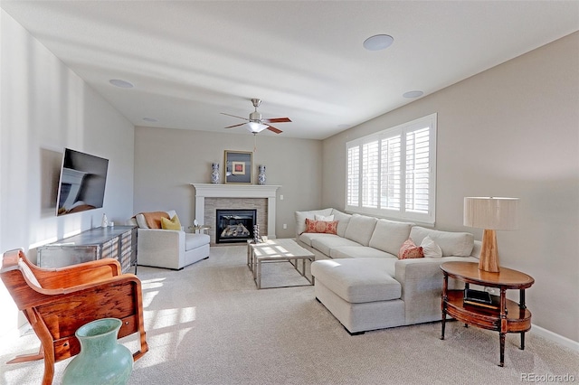 carpeted living room with ceiling fan