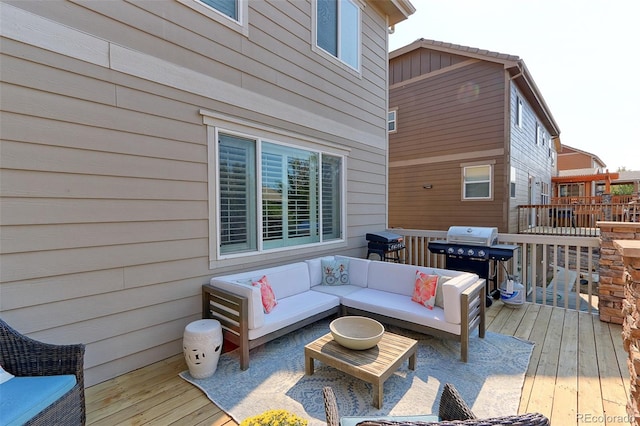 deck with area for grilling and an outdoor hangout area