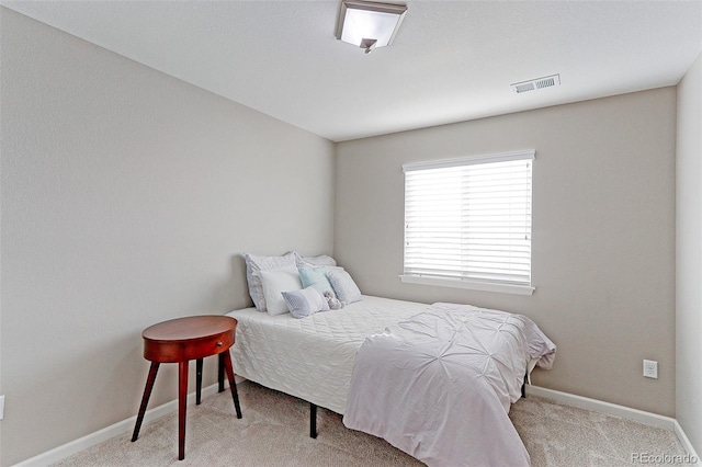 bedroom featuring light colored carpet