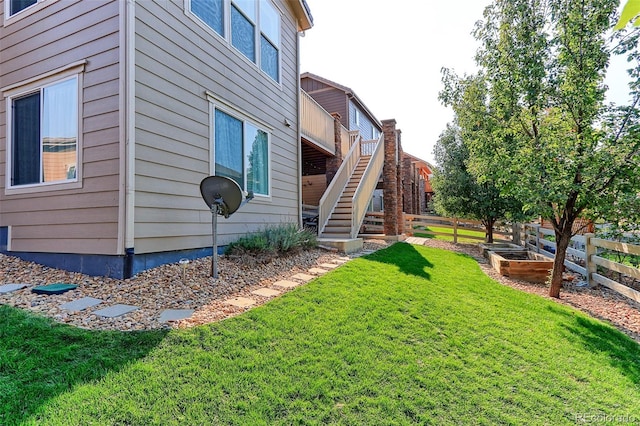 view of side of home featuring a yard