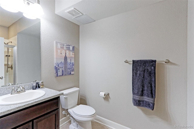 bathroom featuring a shower with door, a textured ceiling, toilet, vanity, and tile patterned flooring