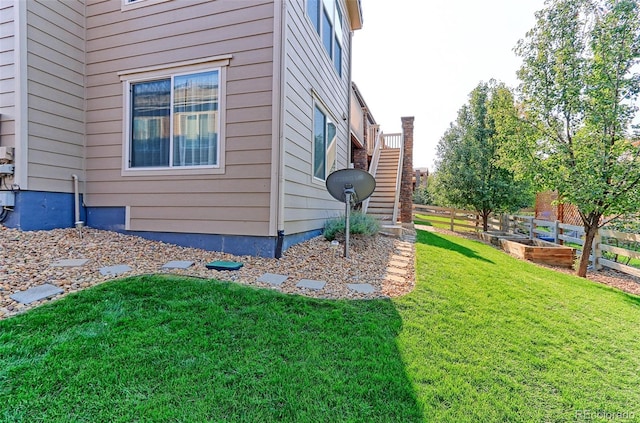 view of home's exterior featuring a yard