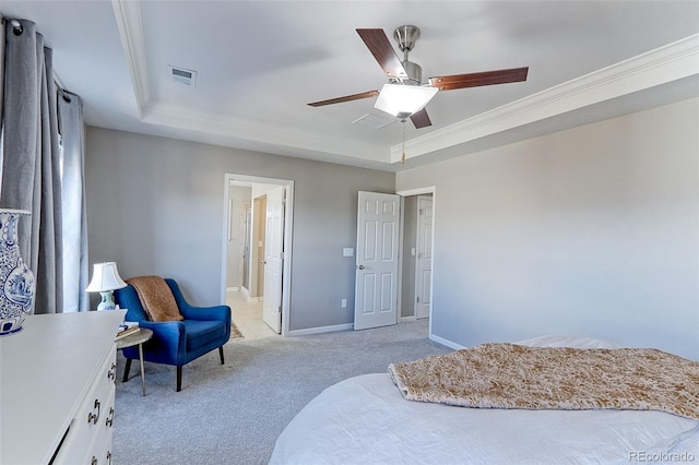 bedroom featuring a tray ceiling, light colored carpet, baseboards, ornamental molding, and visible vents