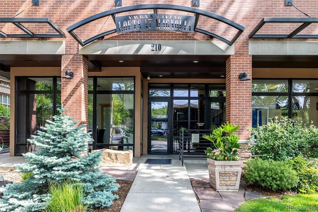 210 W Magnolia St Unit 360, Fort Collins, CO 80521 - property entrance featuring brick siding