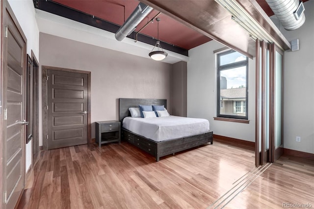 210 W Magnolia St Unit 360, Fort Collins, CO 80521 - bedroom with light wood-style flooring and baseboards