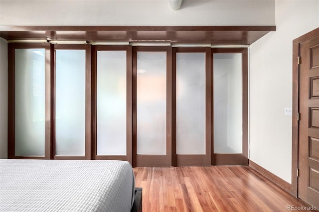 210 W Magnolia St Unit 360, Fort Collins, CO 80521 - bedroom with light wood finished floors
