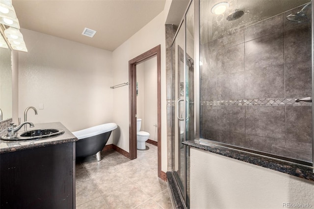 210 W Magnolia St Unit 360, Fort Collins, CO 80521 - bathroom with a stall shower, tile patterned floors, vanity, and toilet