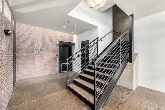 210 W Magnolia St Unit 360, Fort Collins, CO 80521 - stairway with brick wall