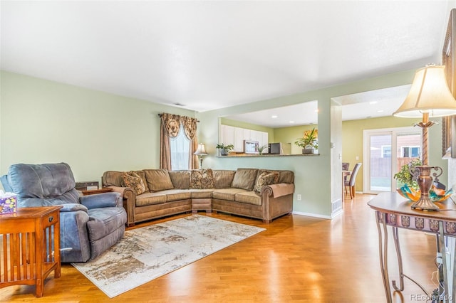 5320 E 100th Dr, Thornton, CO 80229 - living area with light wood-style flooring and baseboards