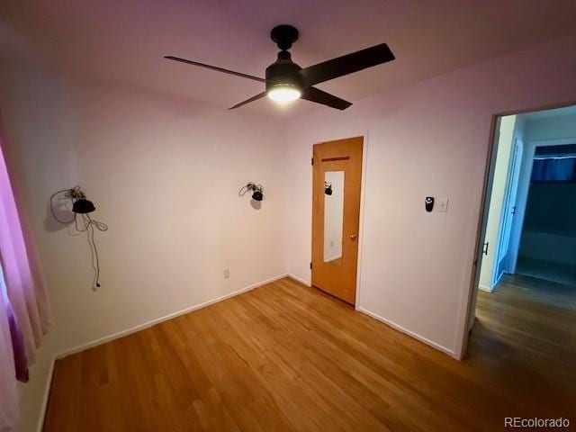 1907 S Newton St, Denver, CO 80219 - unfurnished bedroom featuring wood finished floors and a ceiling fan