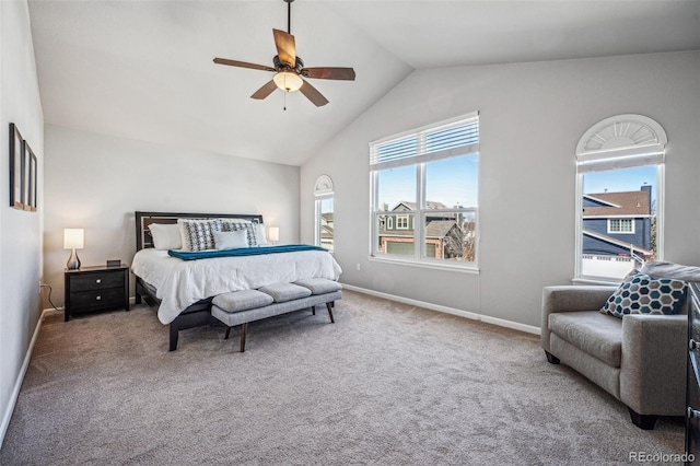 carpeted bedroom with lofted ceiling, ceiling fan, and baseboards