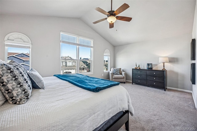 carpeted bedroom with a ceiling fan, lofted ceiling, and baseboards