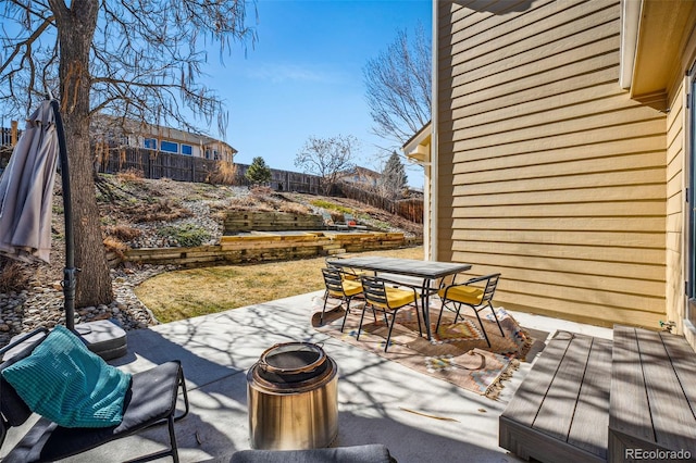 view of patio featuring outdoor dining space and a fenced backyard