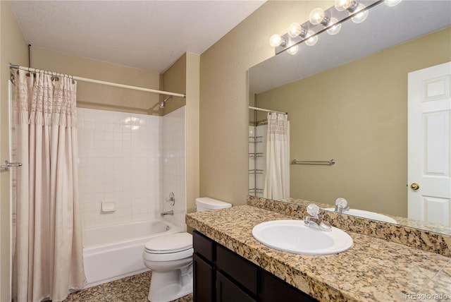 full bathroom with vanity, shower / tub combo, toilet, and a textured ceiling