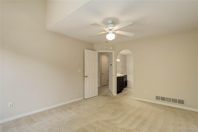 unfurnished room featuring ceiling fan and light colored carpet