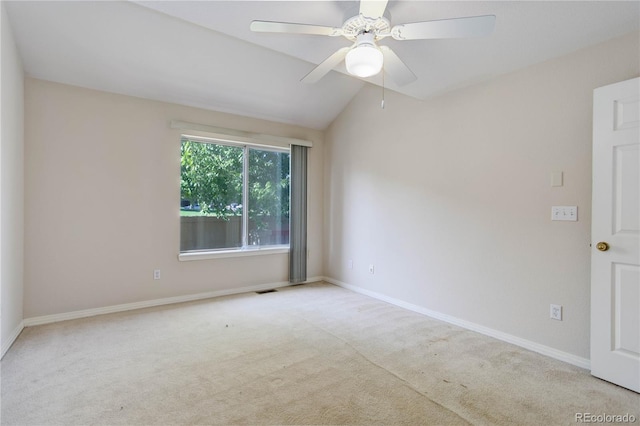 unfurnished room with lofted ceiling, ceiling fan, and light carpet