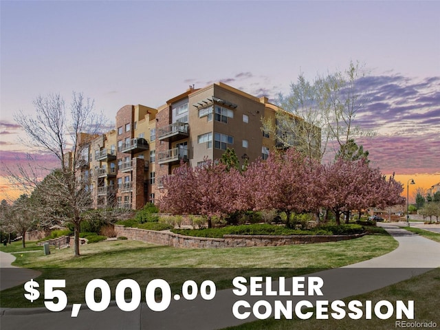 9019 E Panorama Cir Unit D204, Englewood, CO 80112 - property at dusk with a view of apartment building / complex