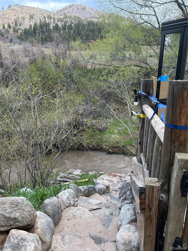 exterior space featuring a water and mountain view