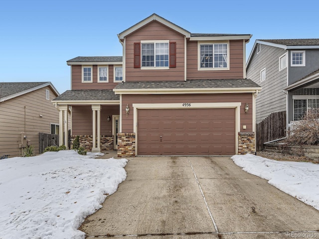 view of front of property featuring a garage