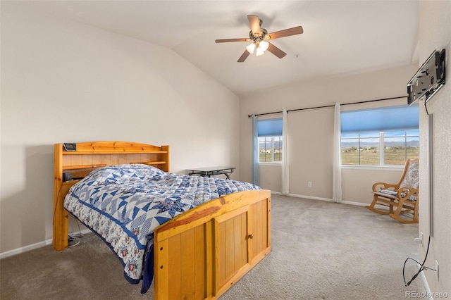 2405 Calais Dr Unit 18A, Longmont, CO 80504 - bedroom featuring light colored carpet, vaulted ceiling, baseboards, and ceiling fan
