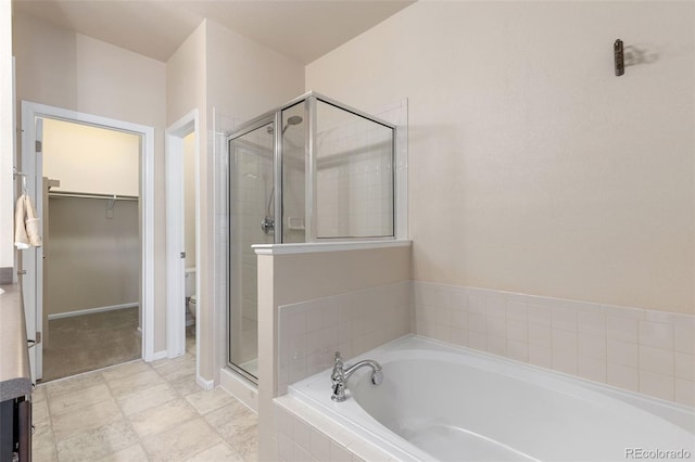 2405 Calais Dr Unit 18A, Longmont, CO 80504 - full bath with a stall shower, a bath, toilet, and a walk in closet