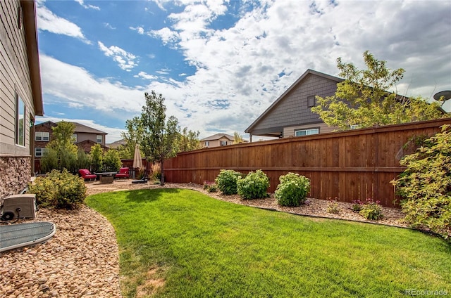 view of yard with an outdoor fire pit, a patio area, and fence private yard