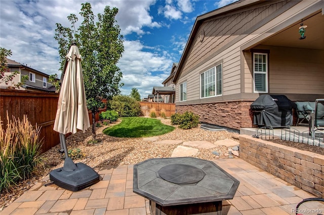 view of patio with fence and grilling area