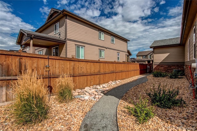 view of home's exterior featuring fence private yard