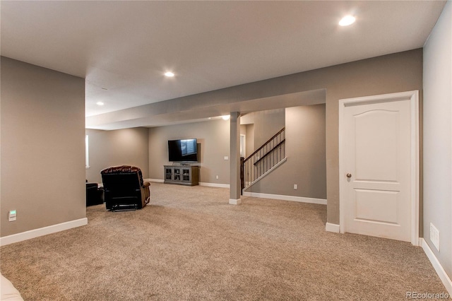 finished basement with stairs, carpet floors, and recessed lighting