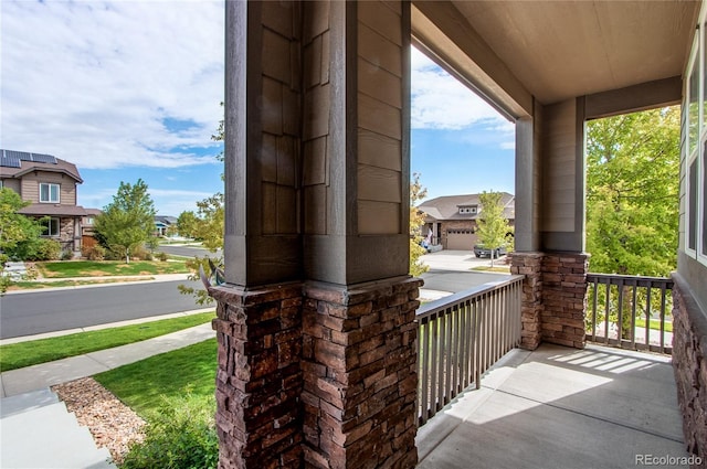 view of patio / terrace with covered porch and a residential view