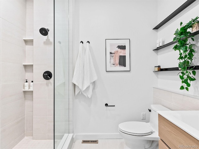 1601 Park Ave Unit 212, Denver, CO 80218 - full bath with toilet, a tile shower, vanity, baseboards, and tile patterned floors