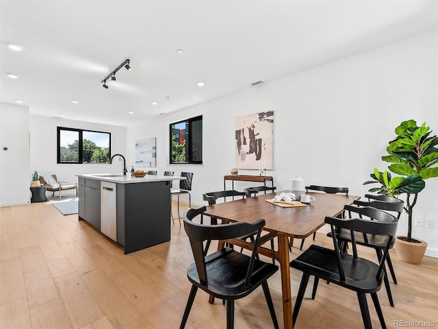 1601 Park Ave Unit 212, Denver, CO 80218 - dining space with recessed lighting, visible vents, light wood-style flooring, and track lighting