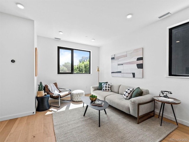 1601 Park Ave Unit 212, Denver, CO 80218 - living area featuring light wood-type flooring, baseboards, and visible vents